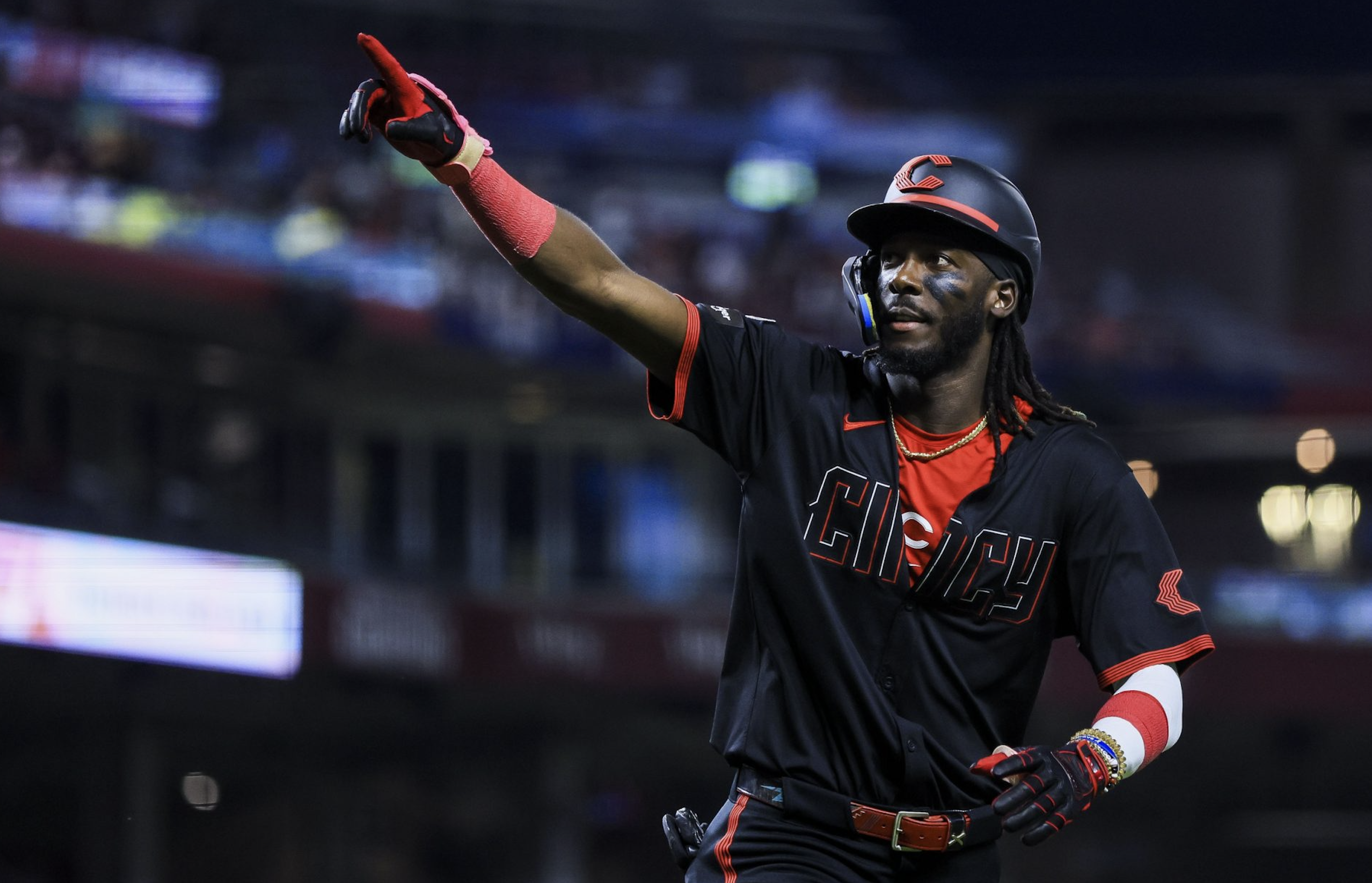 Elly De La Cruz points to the sky after a home run in his Cincinnati Reds City Connect uniform