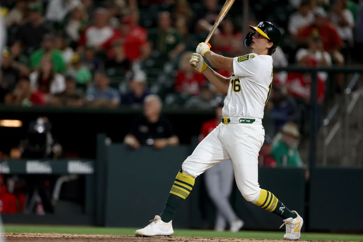 Nick Kurtz swinging in an Oakland Athletics home uniform