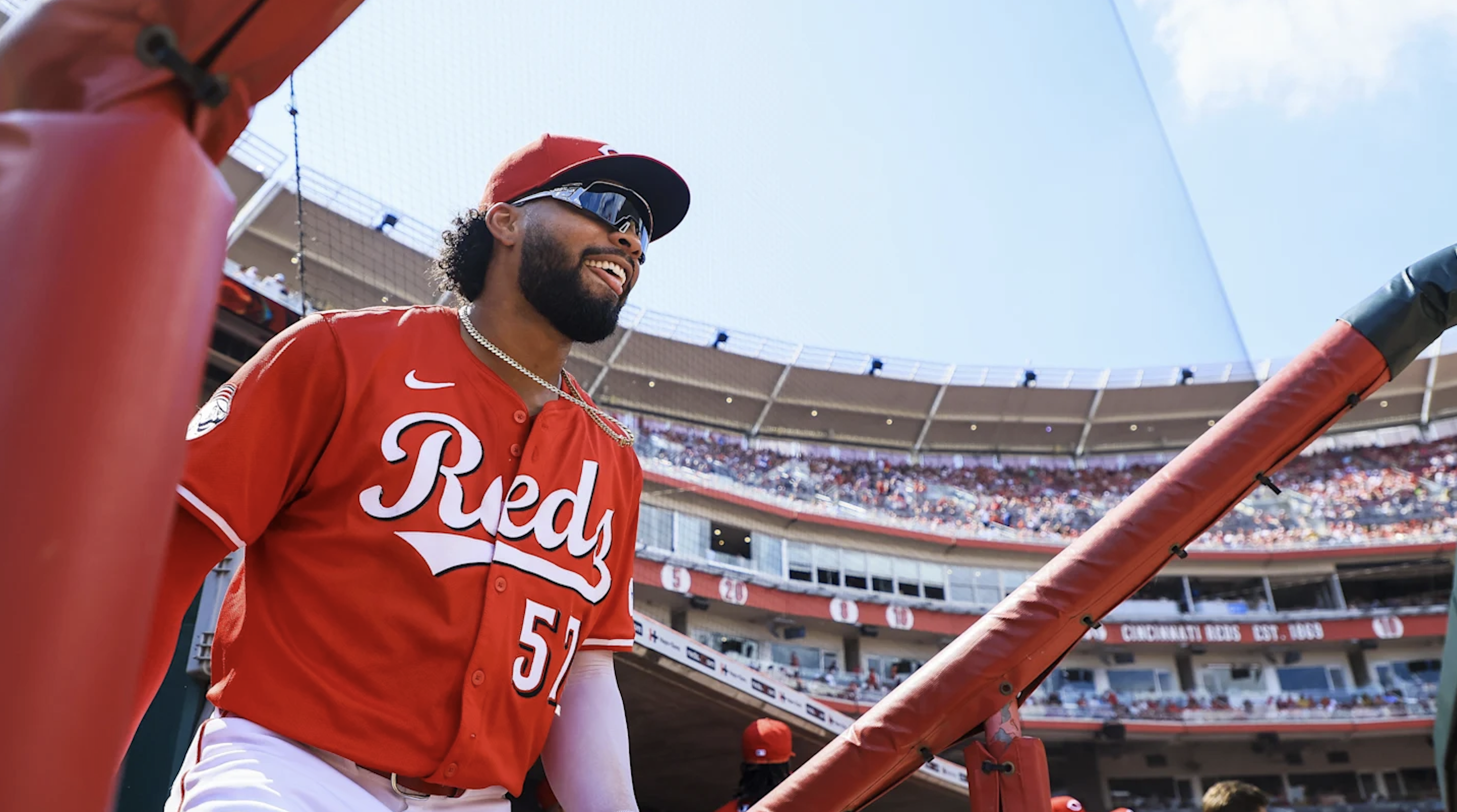 Rece Hinds smiling in the dugout at Great American Ball Park